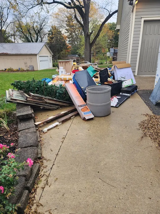 Dumpster being loaded with debris for Roofing Dumpster Rental in South Lake Tahoe